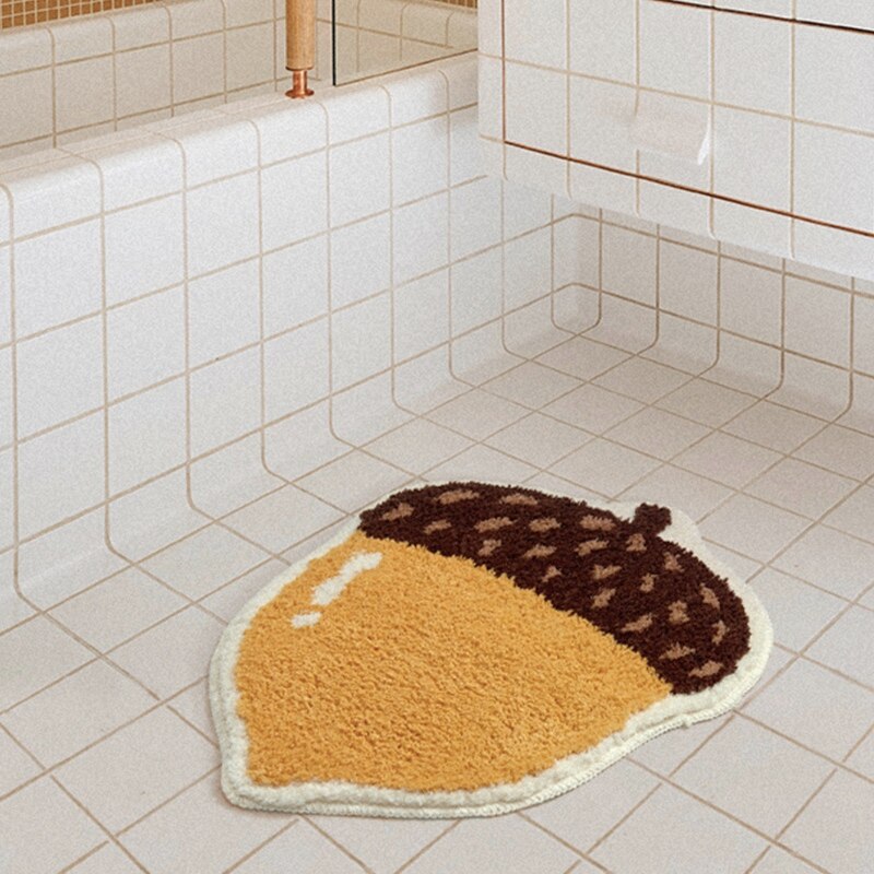 Chestnut shape bath mat with soft microfiber and non-slip underside from Ymonde