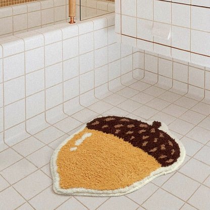 Chestnut shape bath mat with soft microfiber and non-slip underside from Ymonde