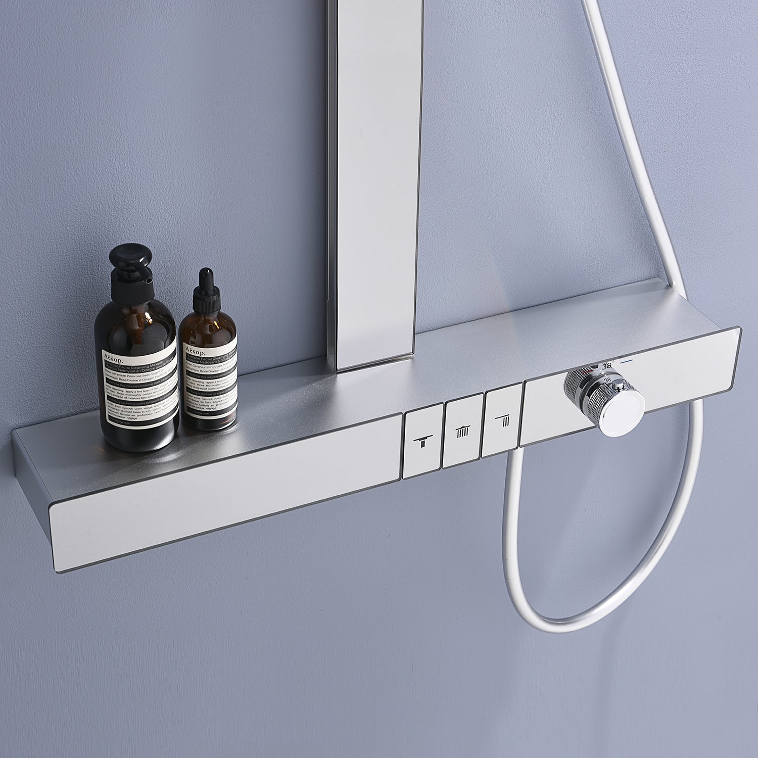 ChromeFlow surface-mounted thermostatic rain shower set in chrome with hand shower from Ymonde