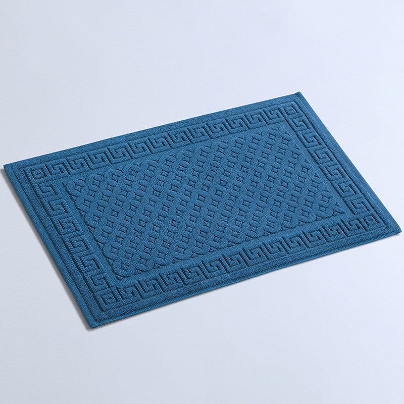 GreekMath cotton bath mat with geometric pattern from Ymonde available in several colors.