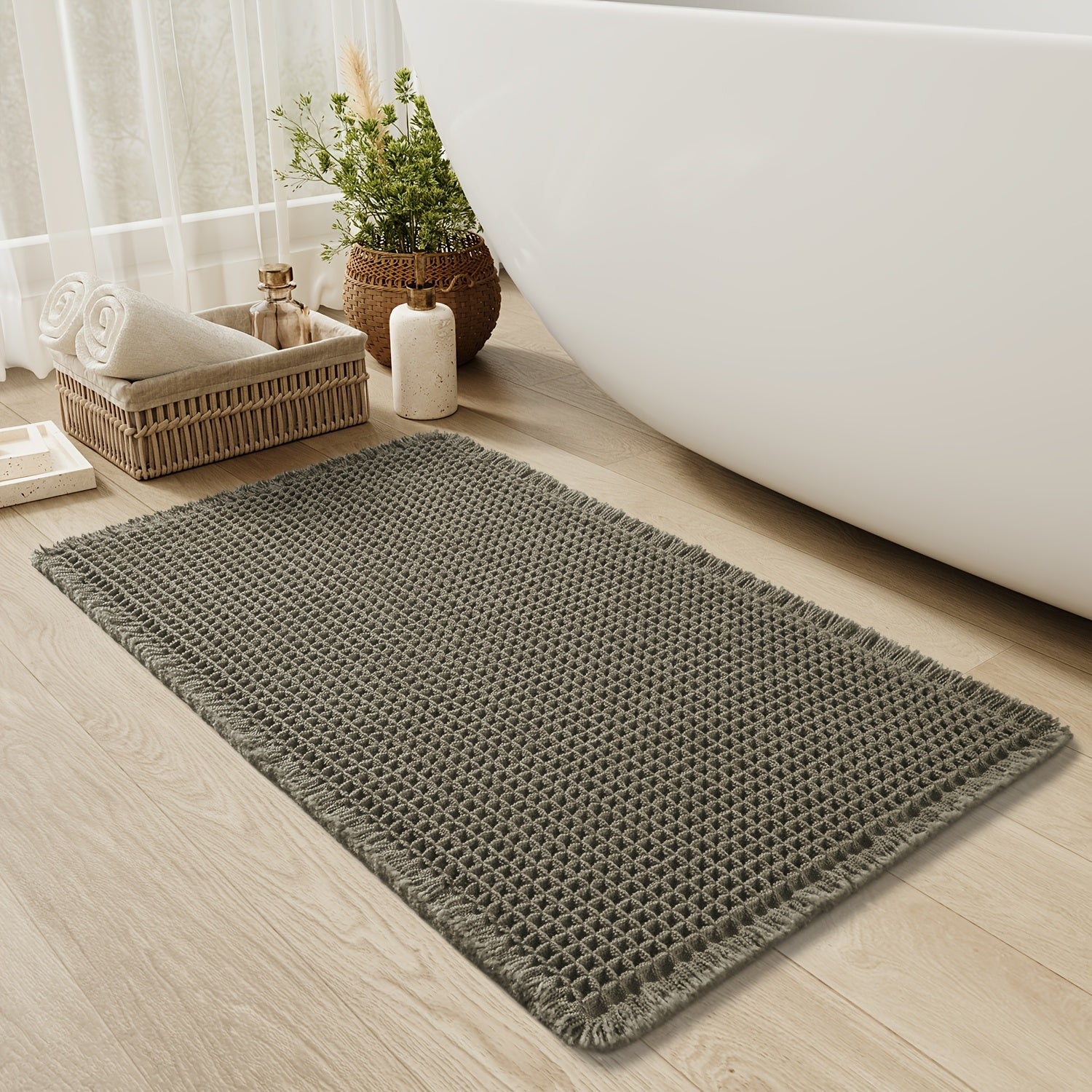 waffly bath mat Ymonde with waffle structure and tassels